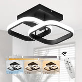 Modern black and white ceiling light fixture with remote control on a neutral background